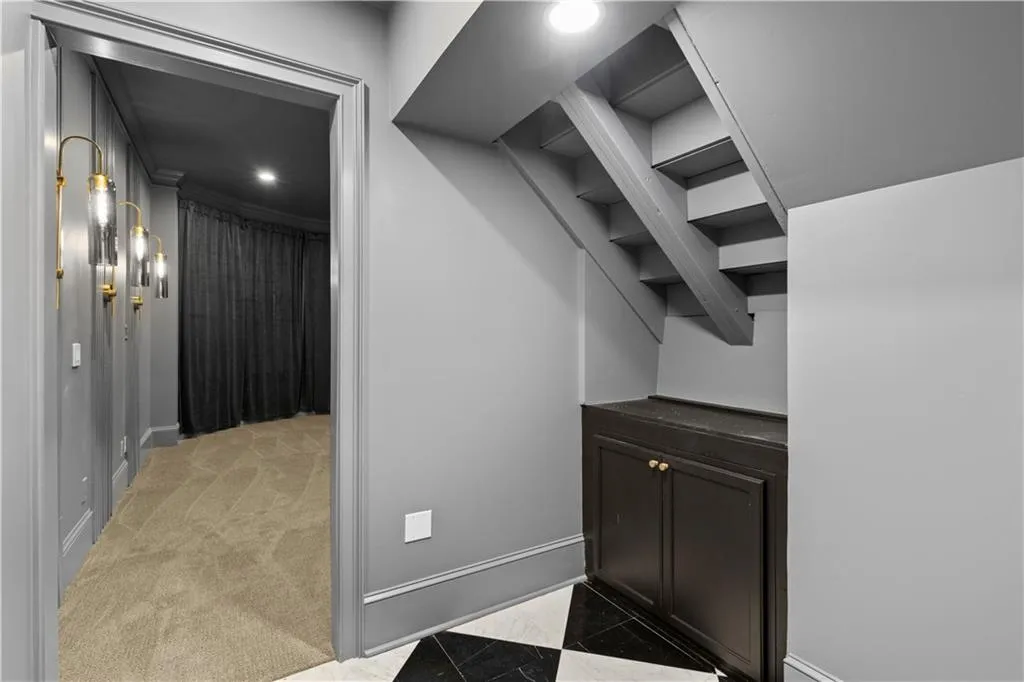 Walk in closet featuring light carpet
