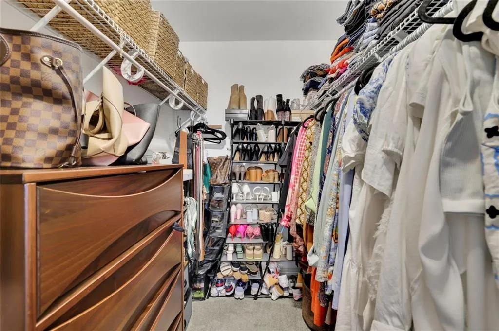 Walk in closet with carpet