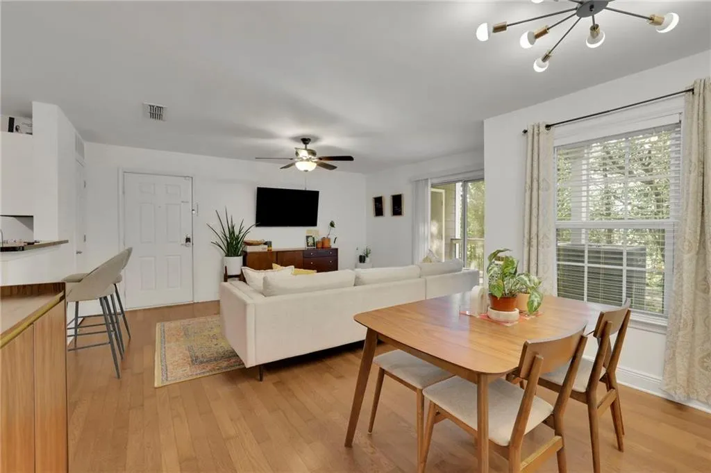 Dining room featuring light wood-type flooring and ceiling fan