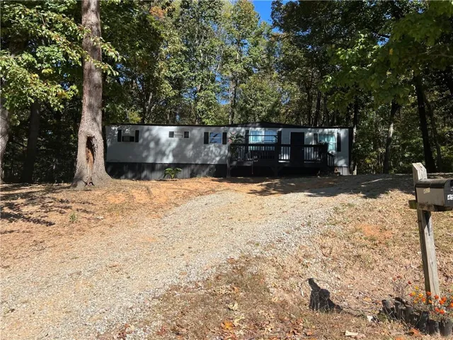 Manufactured / mobile home with a wooden deck