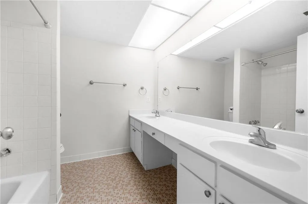 Bathroom featuring tile patterned floors, vanity, and toilet