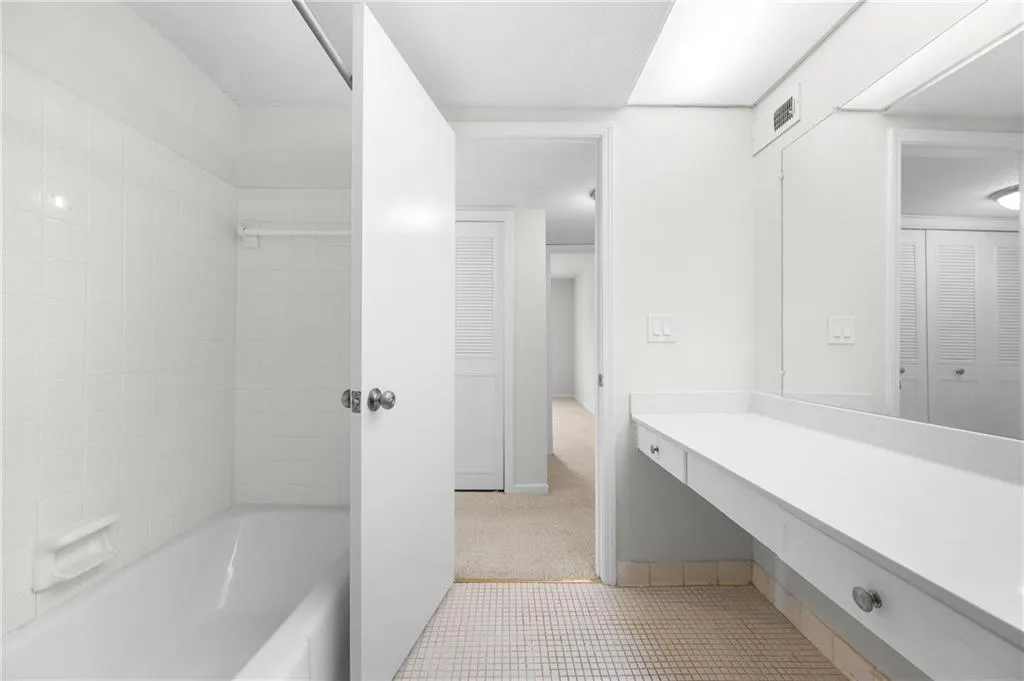 Bathroom with tile patterned flooring and vanity