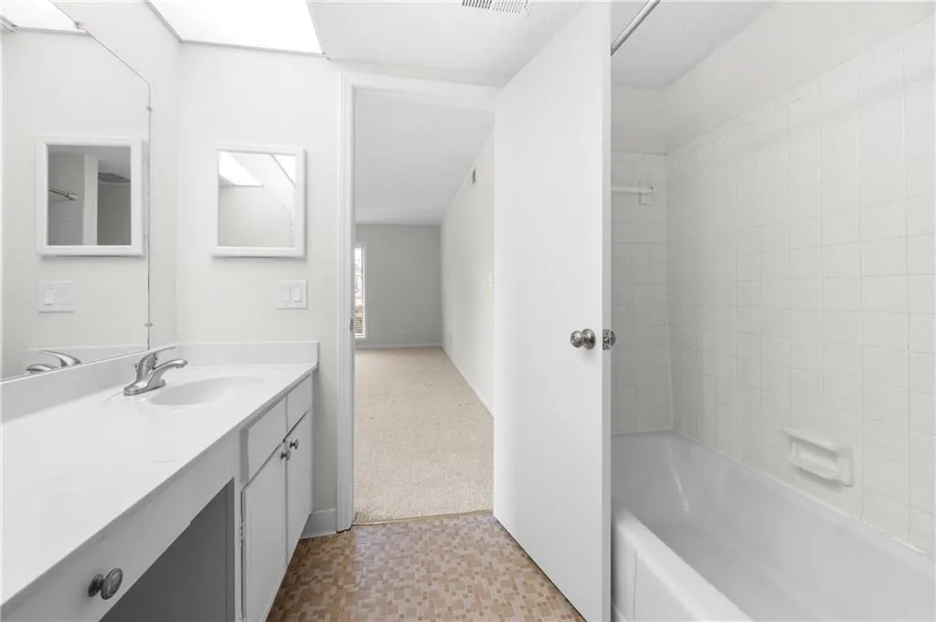 Bathroom with vanity and shower / tub combination