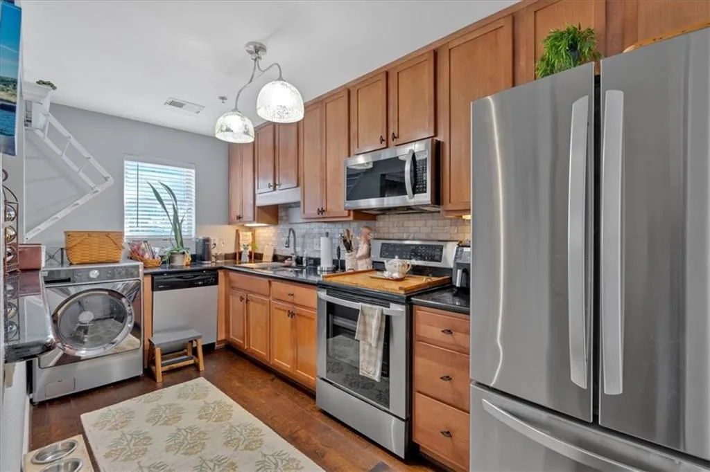 Kitchen featuring lots of prep space, storage space and pantry.