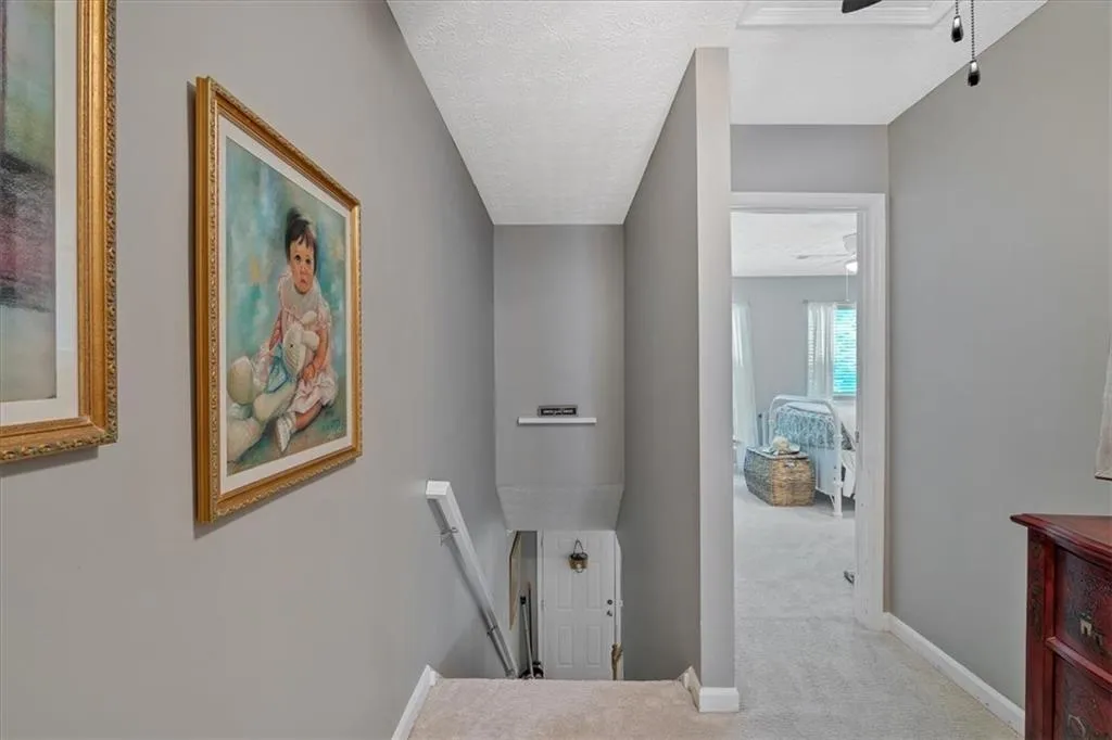 Upstairs Landing with light colored carpet