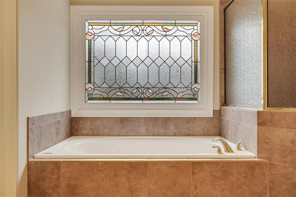 Bathroom featuring tiled tub