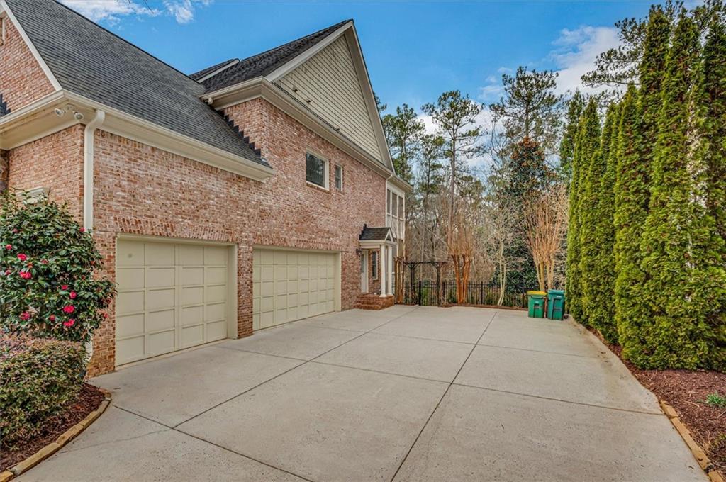 View of side of home featuring a garage