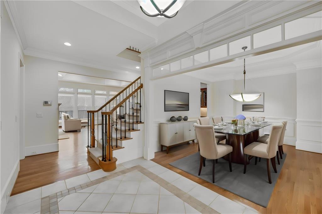 Dining room featuring ornamental molding and light hardwood / wood-style flooring
