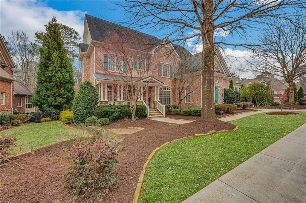 View of front of property with a front yard