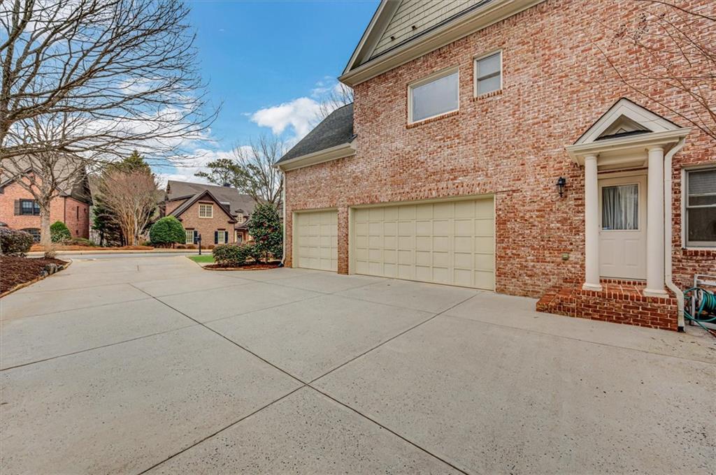 View of side of home with a garage
