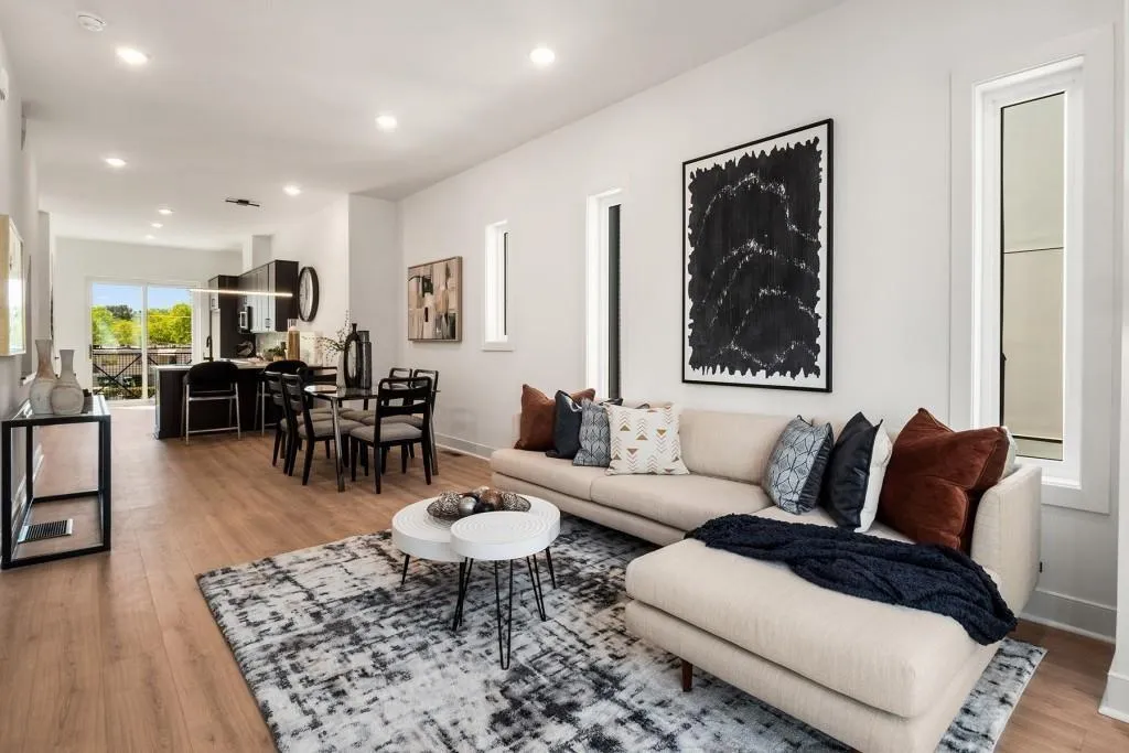 Living area with recessed lighting and light wood-style floors