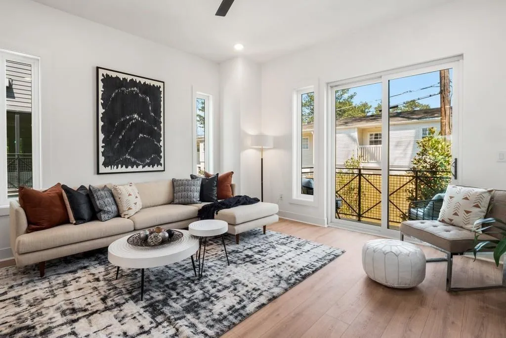 Living area with healthy amount of natural light, light wood-type flooring, recessed lighting, and ceiling fan