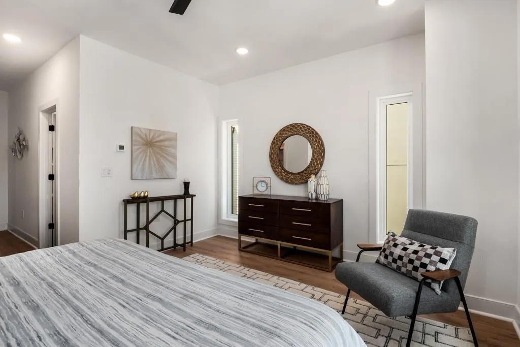 Bedroom with wood finished floors, recessed lighting, and a ceiling fan