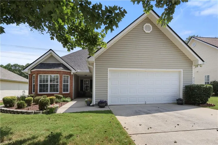 Beige siding exterior with a two-car garage