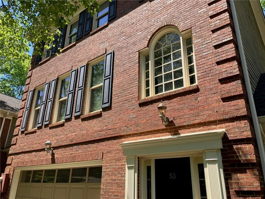 View of building exterior featuring a garage