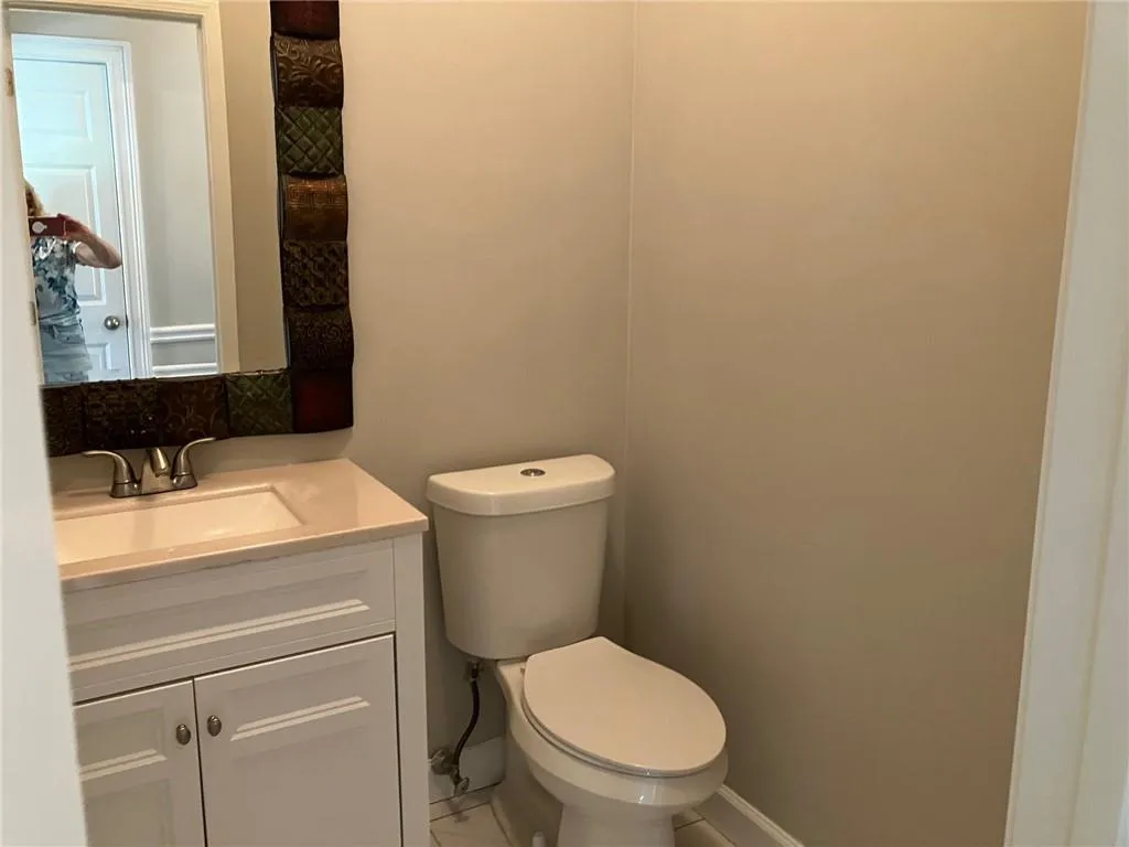 Bathroom featuring vanity and toilet