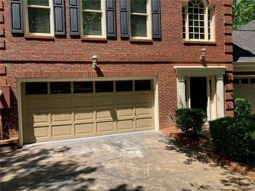 View of front facade featuring a garage