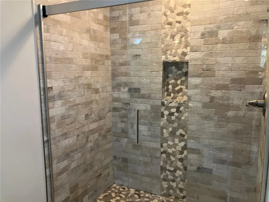 Bathroom with an enclosed shower