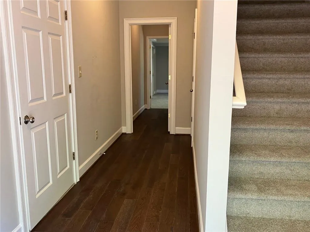 Hallway featuring dark hardwood / wood-style floors