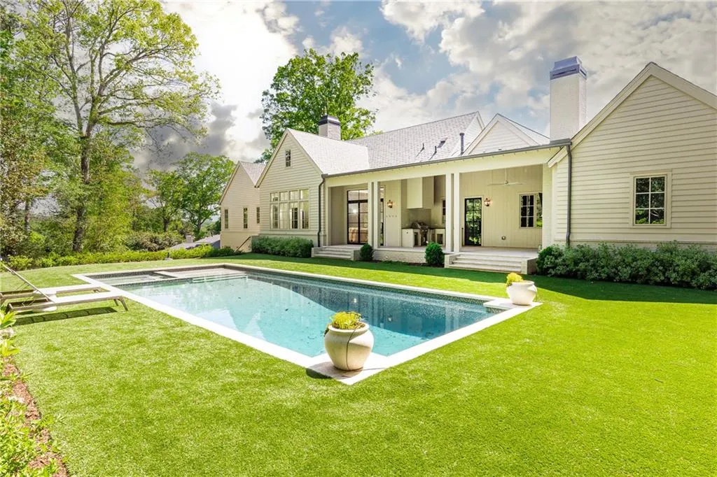 view of pool patio and back of the home