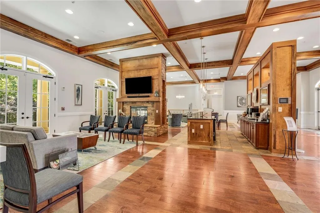 Cozy up to the fire on a winter day and drink some tea or coffee provided for residents by the HOA.  This is the main room of the Meeting House with a bar with a flavored water system, fridge, and ice maker.