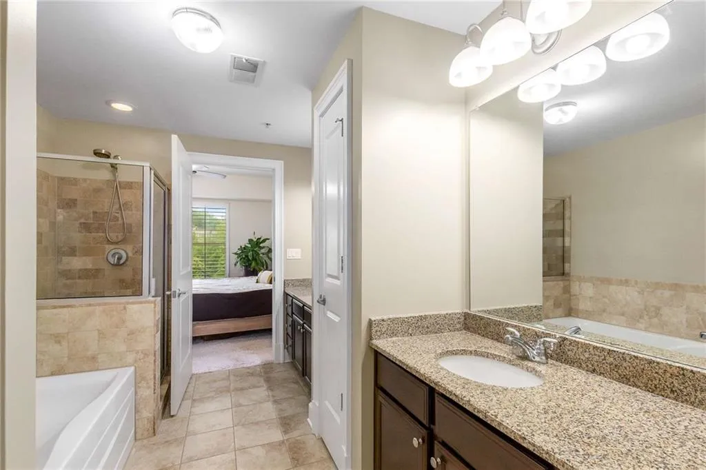 Well kept primary bath has ample storage with 2 separate sink areas.