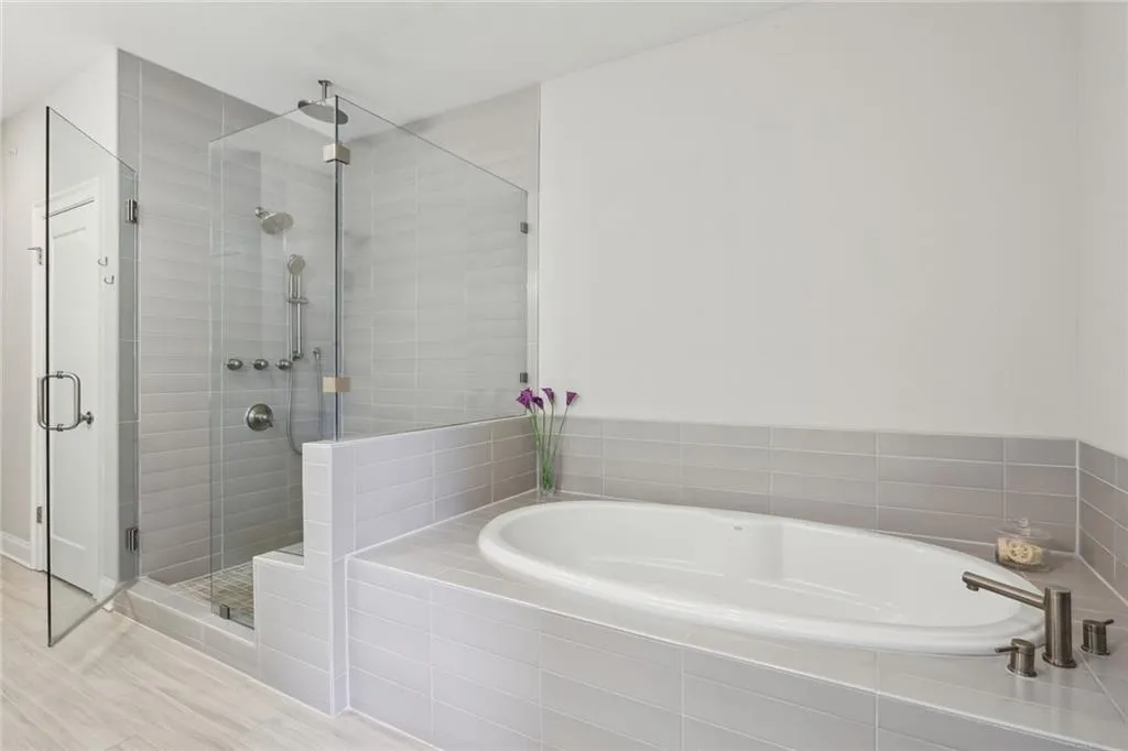 Large soaking tub and glass shower with multiple shoer heads
