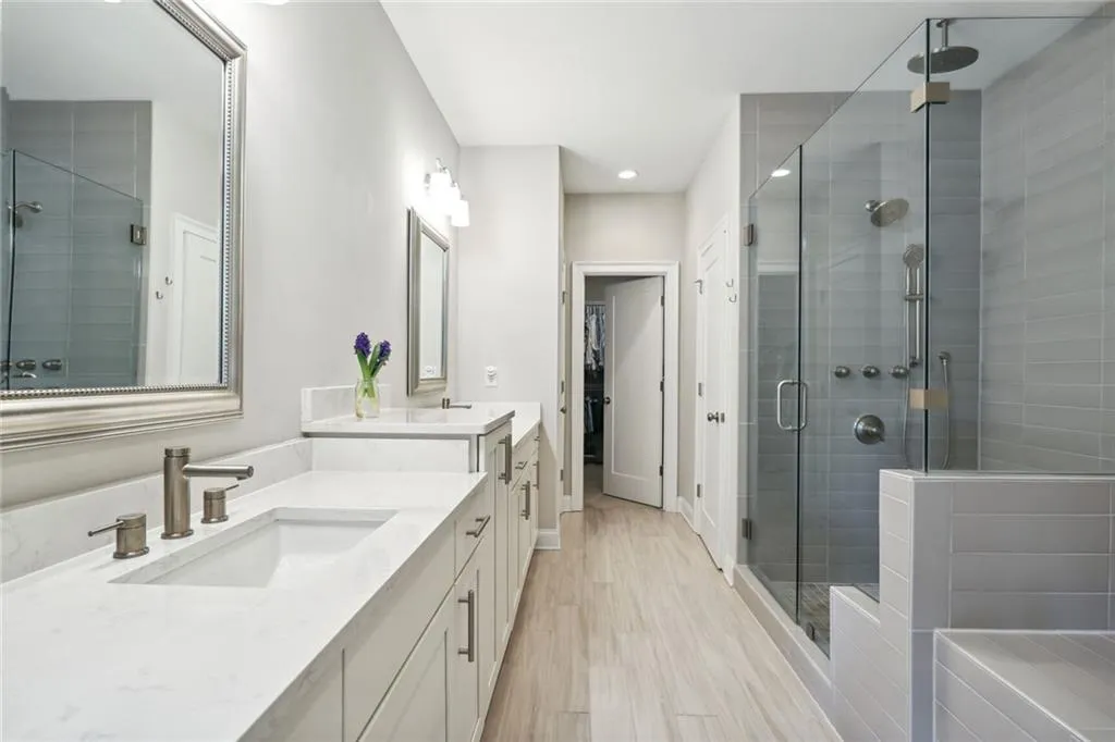 Double vanities, extensive cabinets linen closet and walk in closet