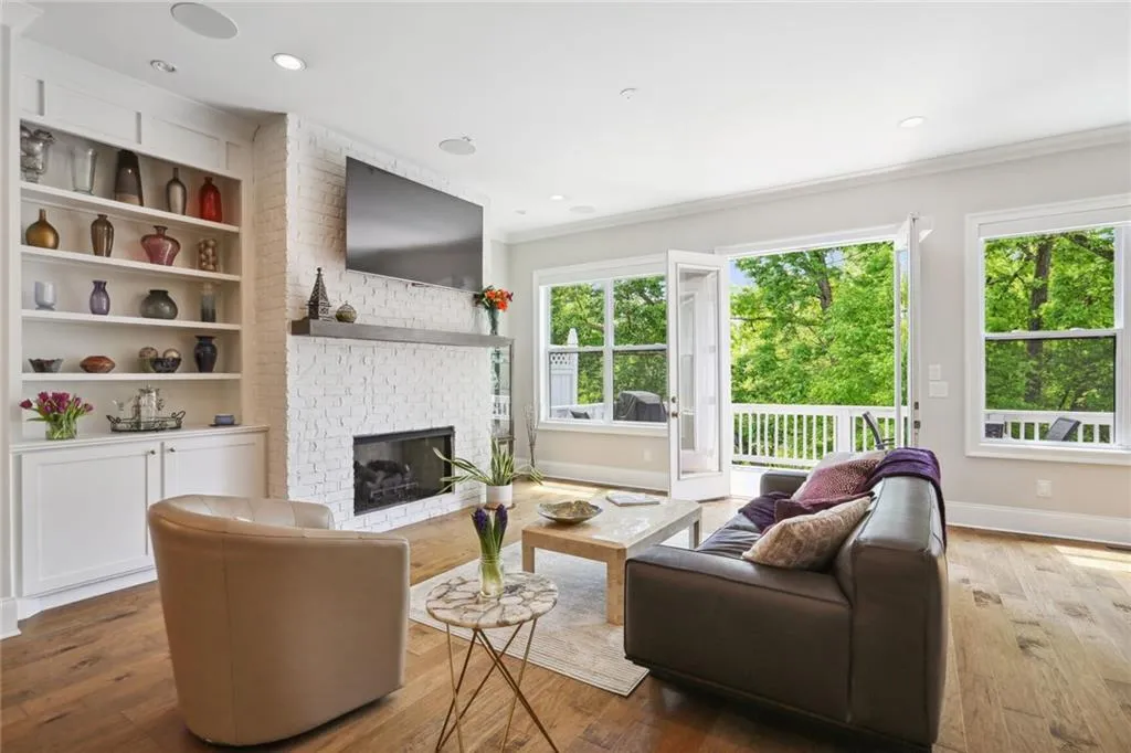 Built in shelves and cabinets and TV above gas fireplace that pulls down for optimal viewing