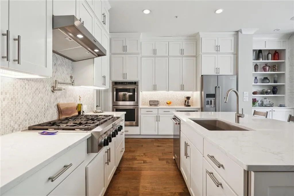 Quartz countertops and artisan tile backsplash