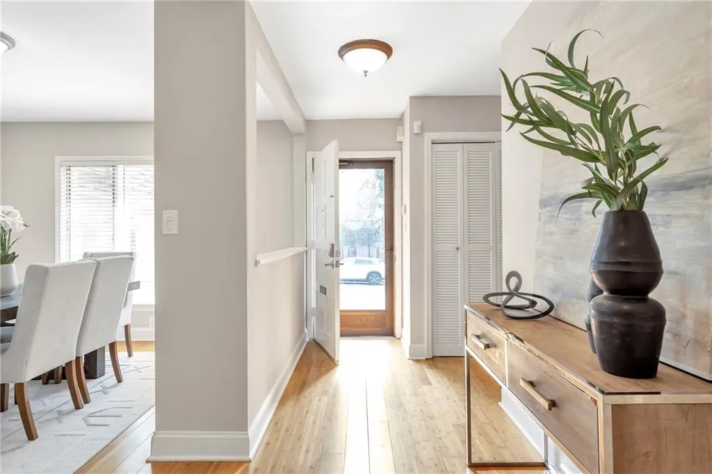 Foyer entrance with light wood-style floors and healthy amount of natural light