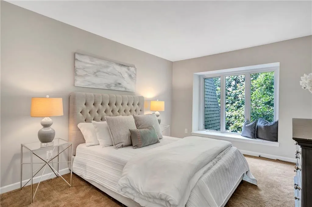 Bedroom with carpet and baseboards