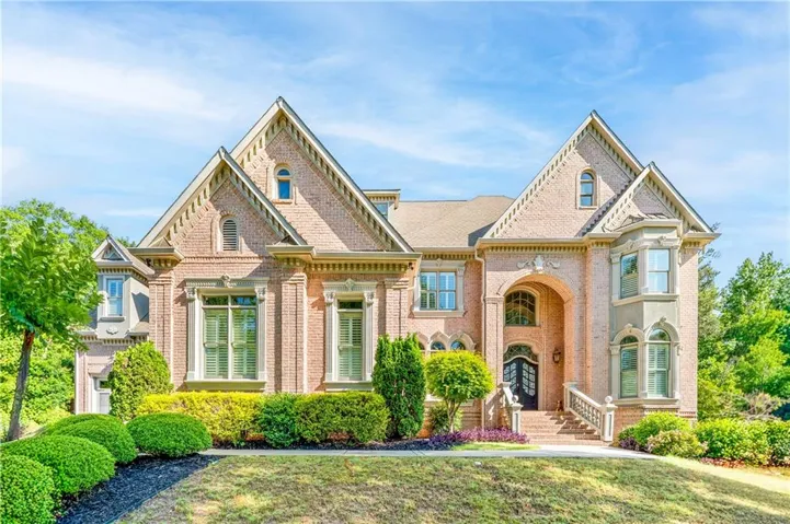 Brick exterior with multiple gables and dormer windows