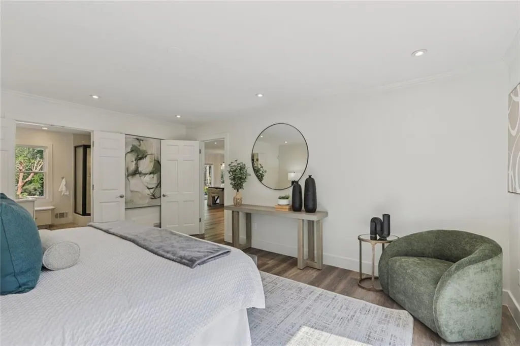 main level bedroom with full bath and balcony