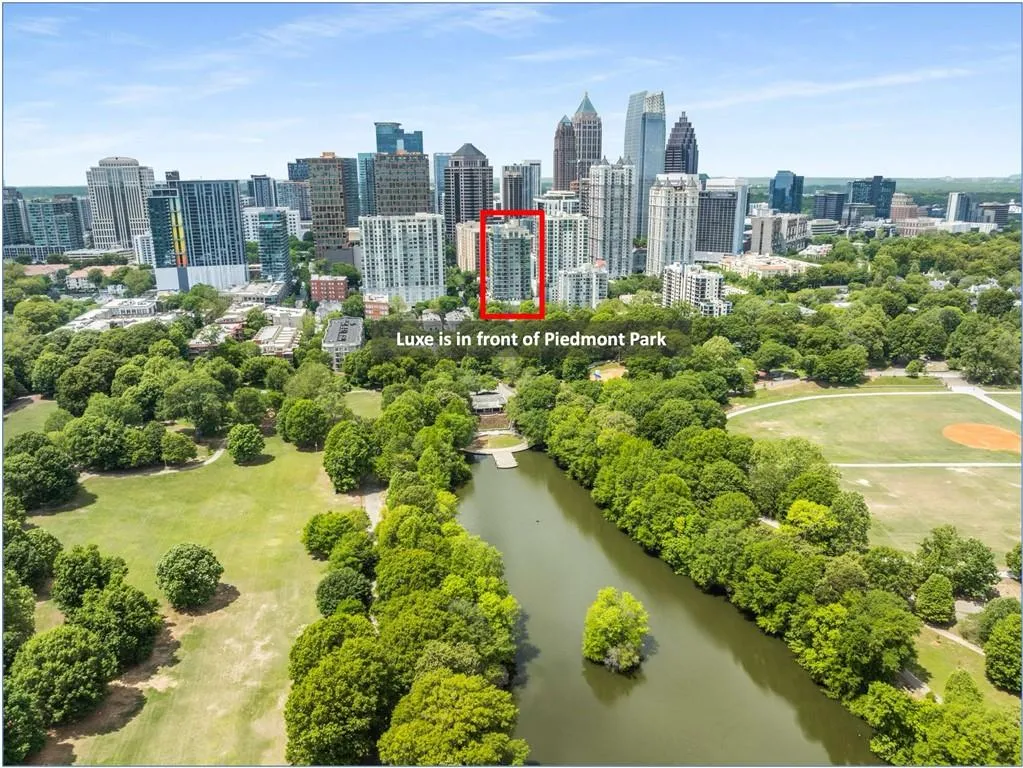 Birds eye view of property featuring a view of city and a water view