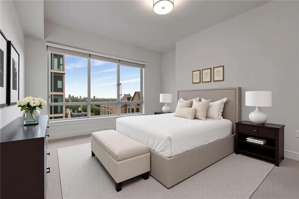 Carpeted bedroom featuring baseboards