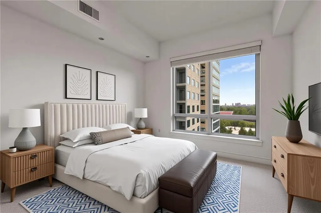 Bedroom featuring carpet flooring, visible vents, and baseboards
