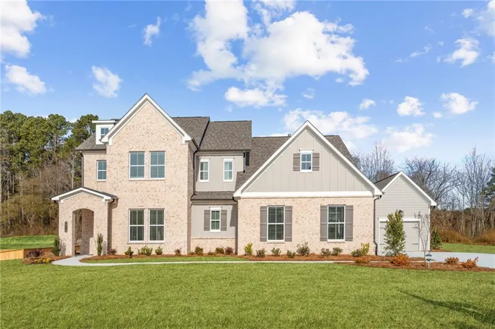 Gorgeous Chatfield plan with a 3rd car garage.  Stately home on .69 acre lot.