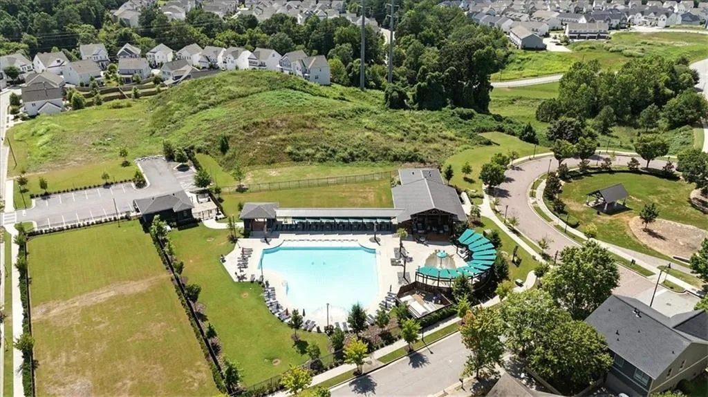 Aerial overview of property's location featuring nearby suburban area