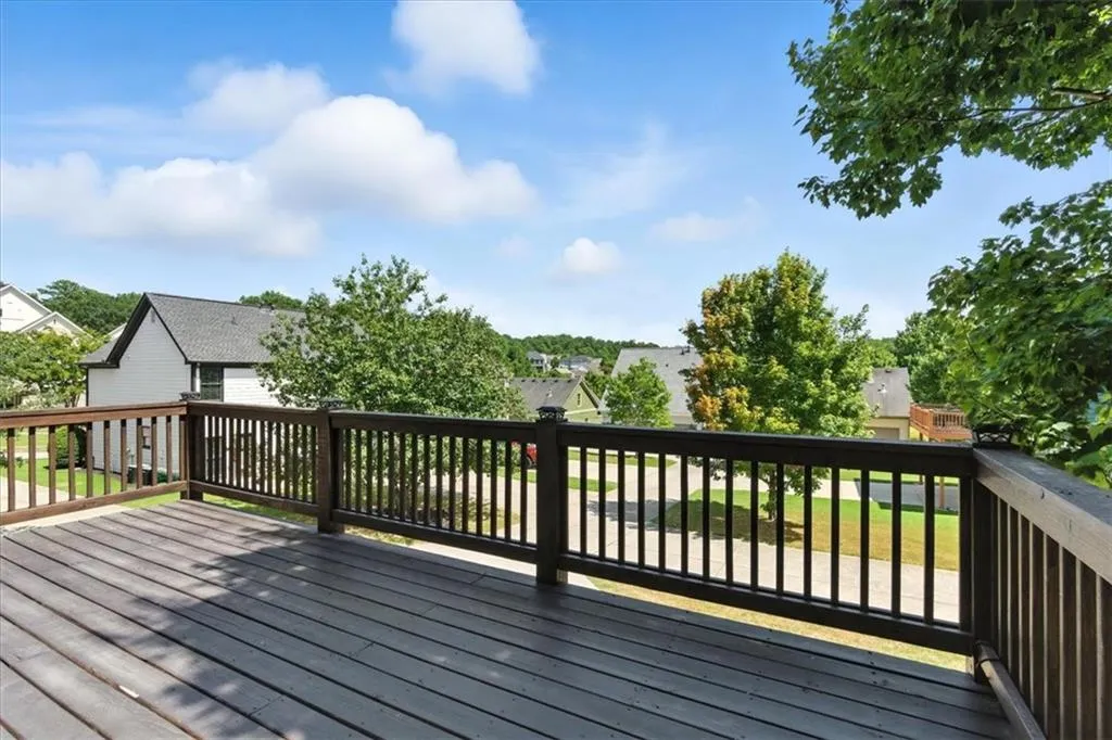 Wooden terrace featuring a residential view