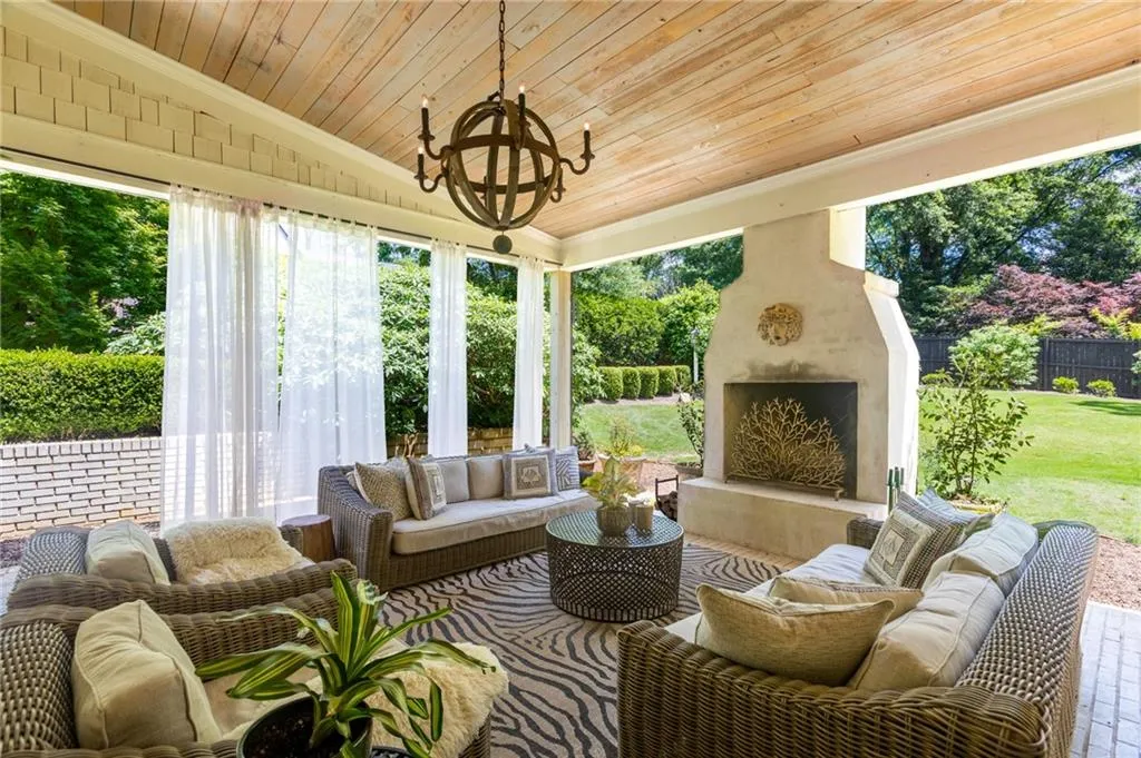 View of patio featuring an outdoor living space with a fireplace