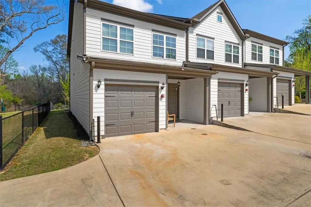 Traditional-style home with an attached garage and driveway