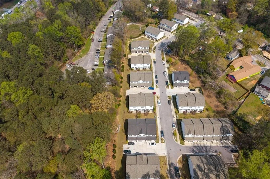 Aerial overview of property's location with nearby suburban area