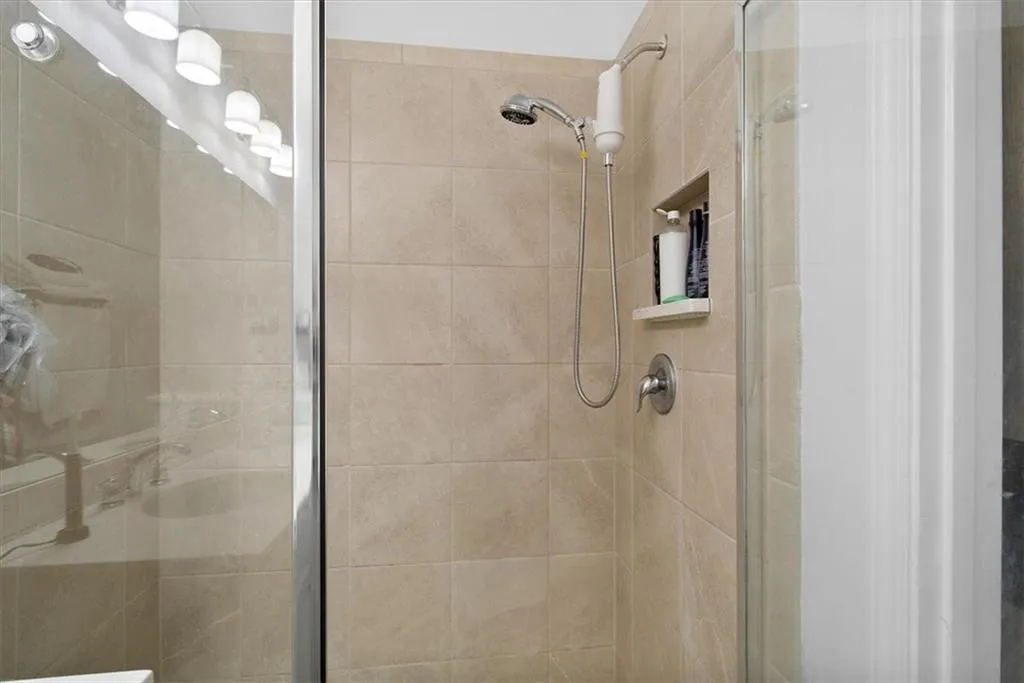 Full bathroom with a stall shower