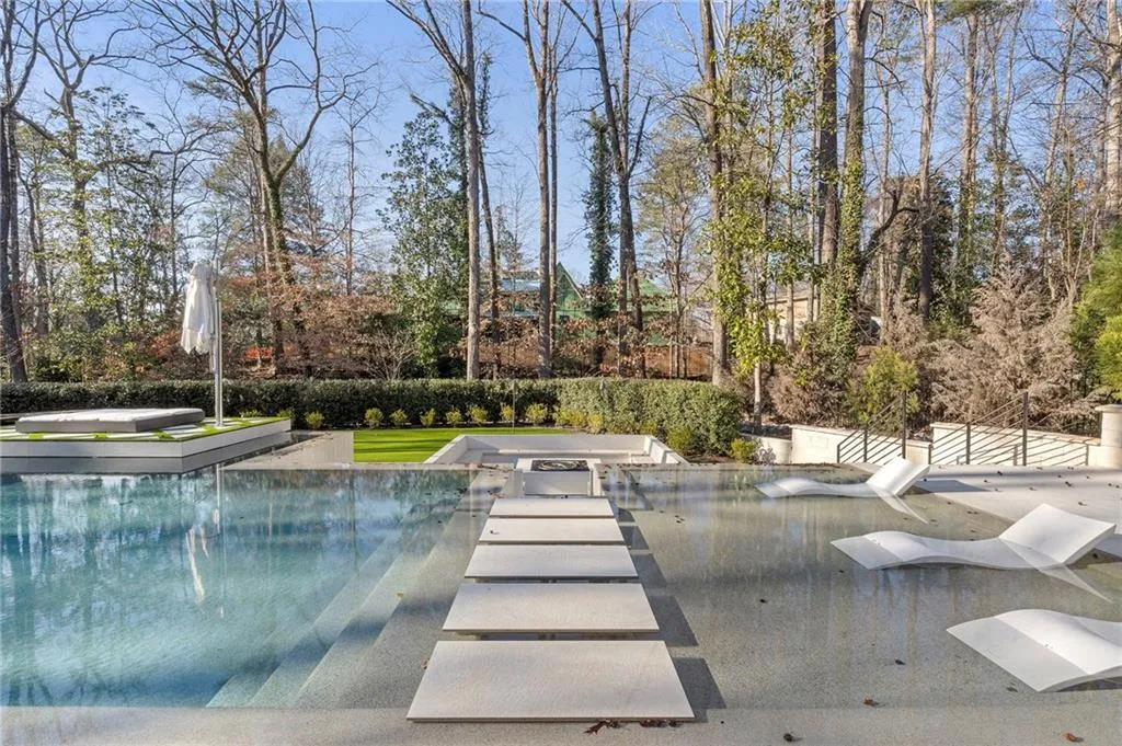 Spa, sun shelves, floating stepping stones. Incredible pool design.