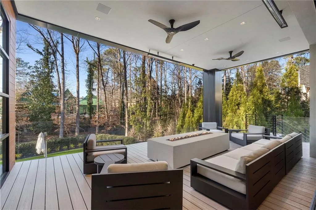 Covered heated patio off of living room with stairs to pool.