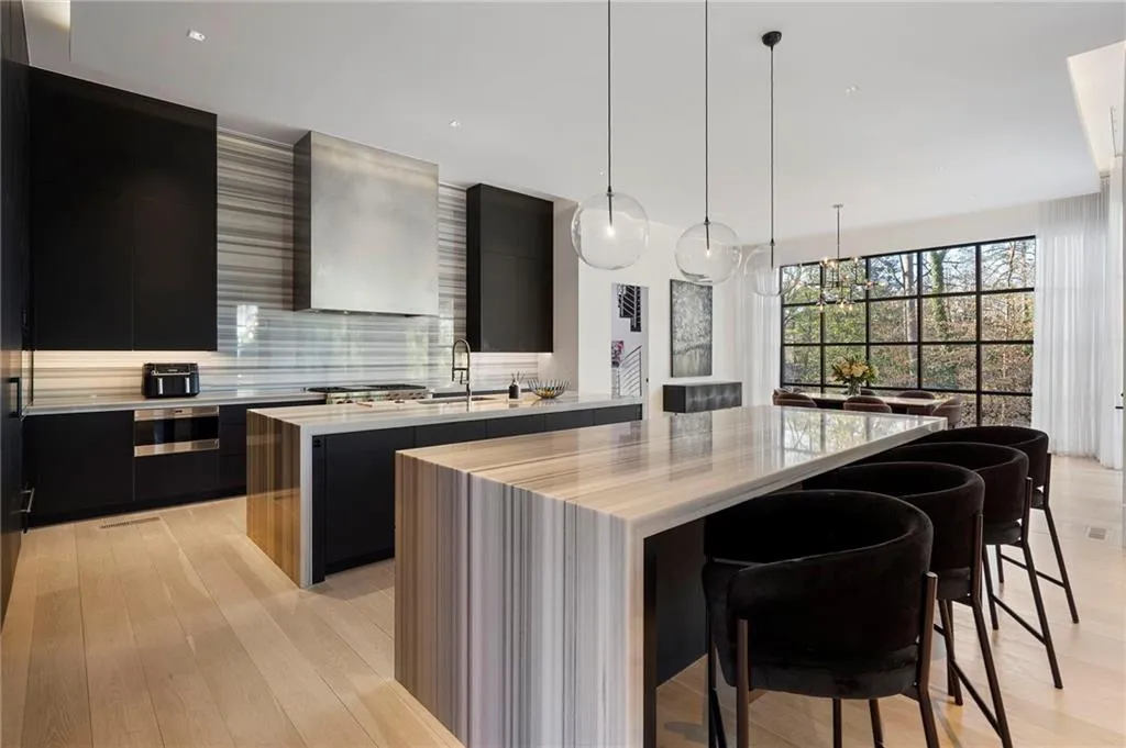 Double marble waterfall islands, walk in pantry.