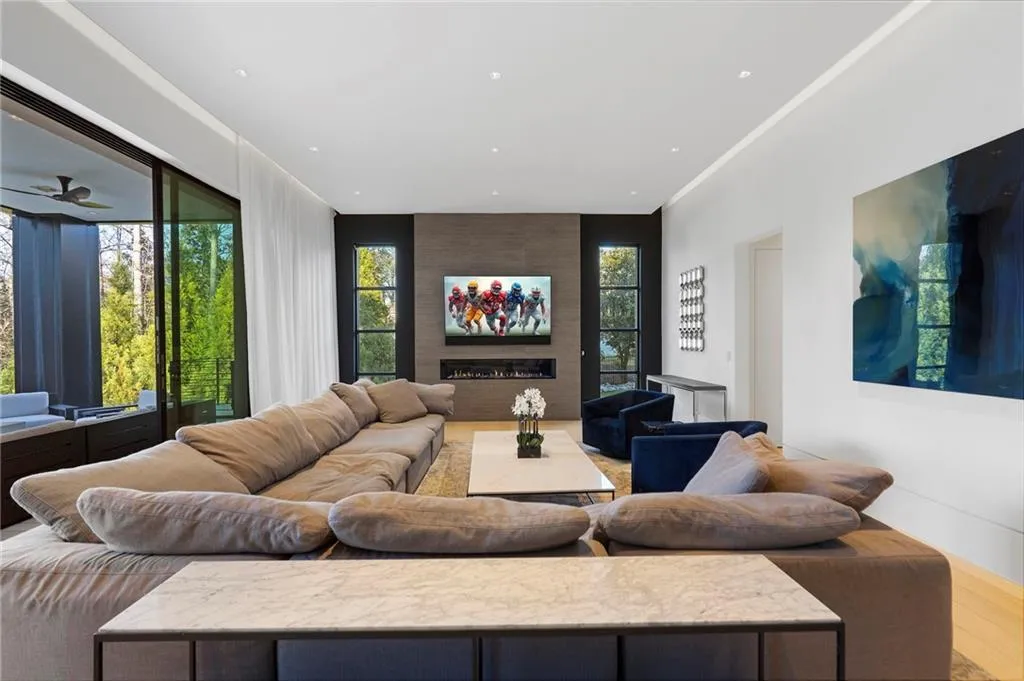 Living room has retractible doors out to heated, covered patio.