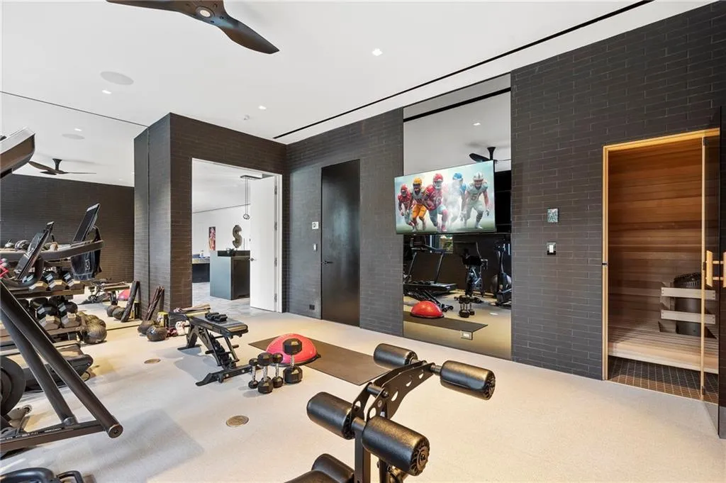 Full size gym overlooking the pool. Sauna too!
