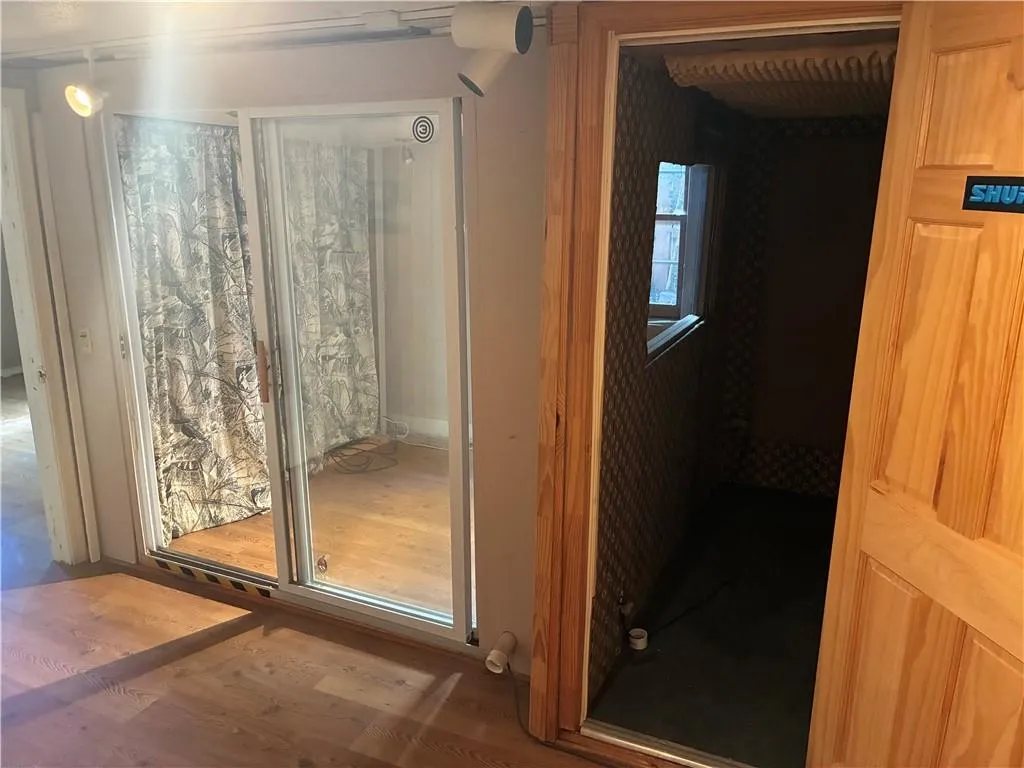 Doorway featuring wood finished floors